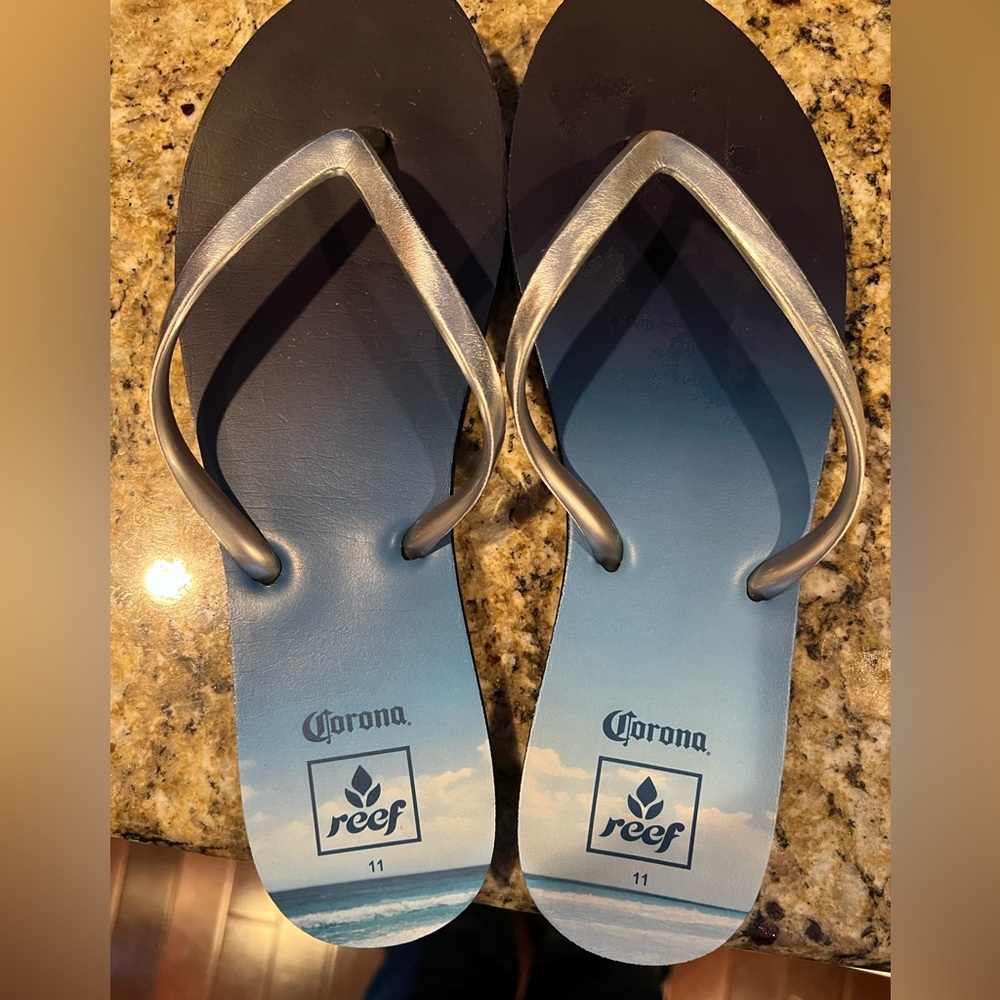 Women’s Size 11 Corona Reef Flip Flop Blue and Silver. Bottle opener. Like New.
